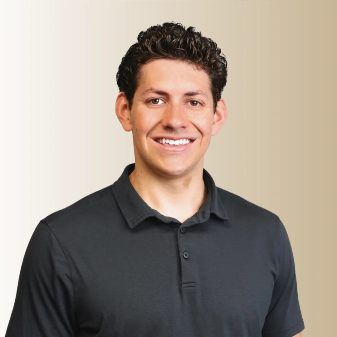 Blake Brown, smiling, in a dark polo shirt